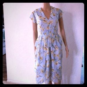 Baby blue ruffles dress with orchid flower